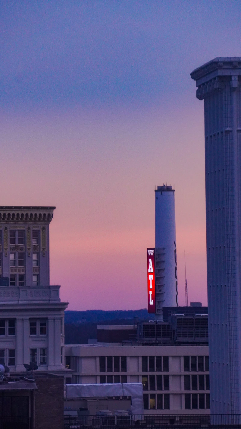 Atlanta corporate event venue - a tall building with a red sign on it's side