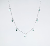 Elegant necklace featuring natural gemstones set in a delicate gold chain.