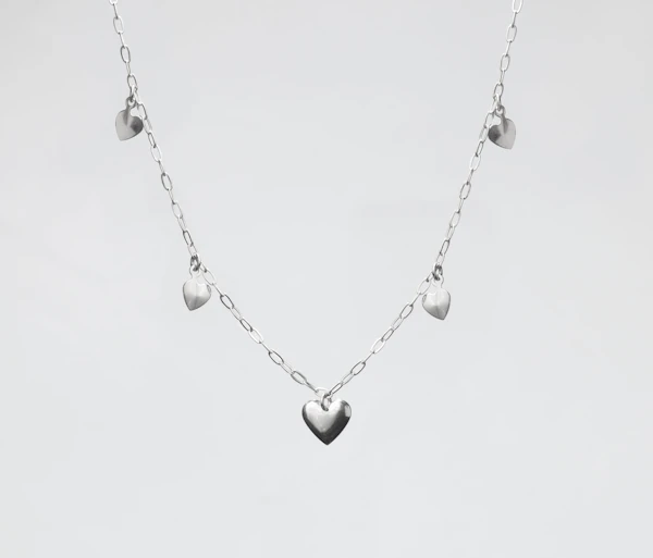 Silver chain necklace with small puffed heart charms