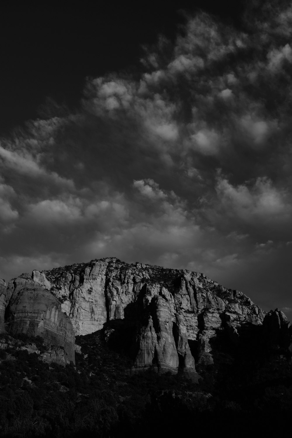 a black and white photo of a mountain