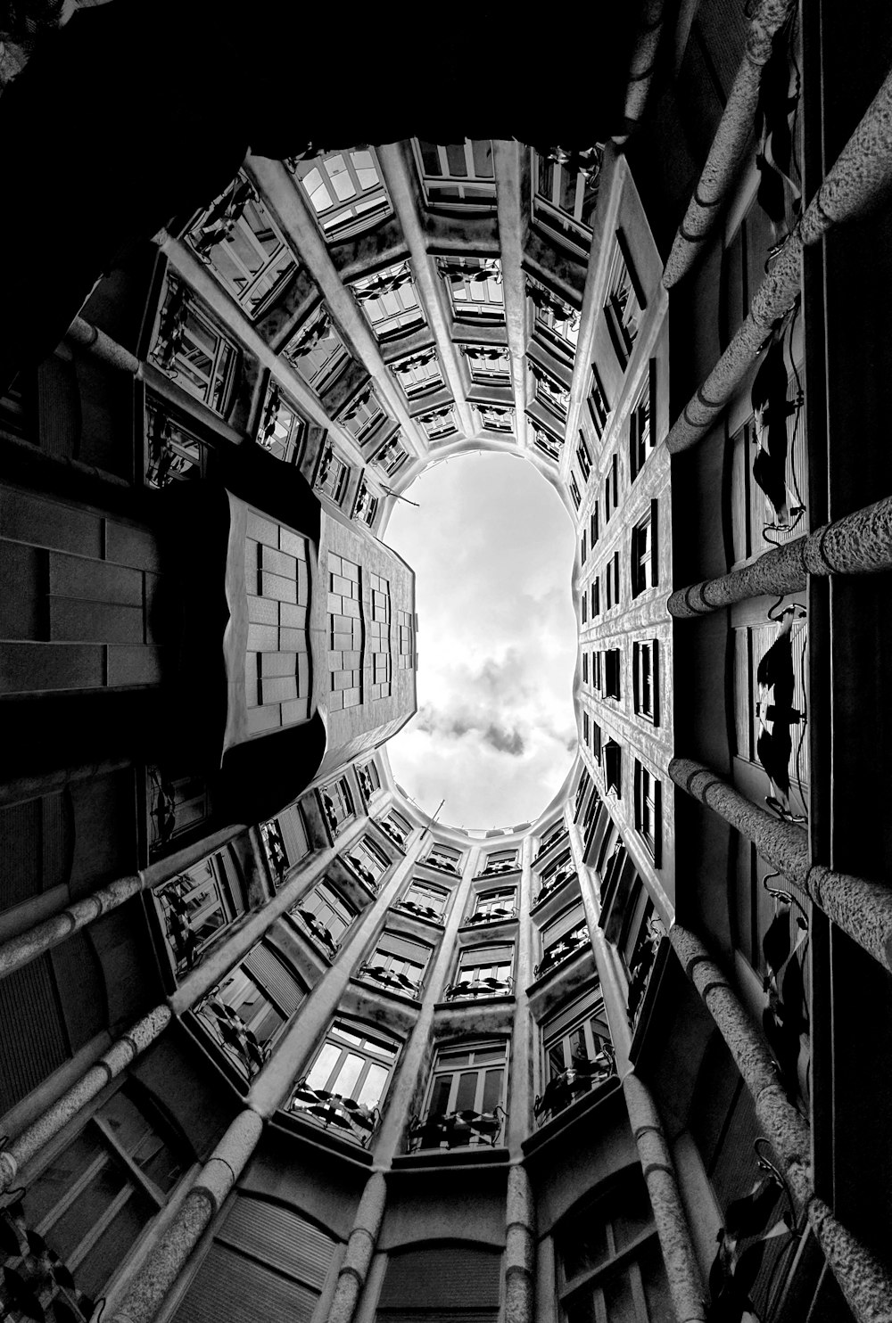 a very tall building with a sky view looking up