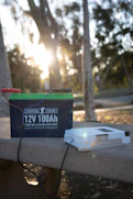a battery and a charger sitting on a ledge