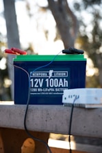 a battery and a charger sitting on a bench