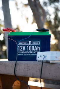 a battery and a charger sitting on a bench