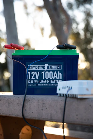 a battery and a charger sitting on a bench