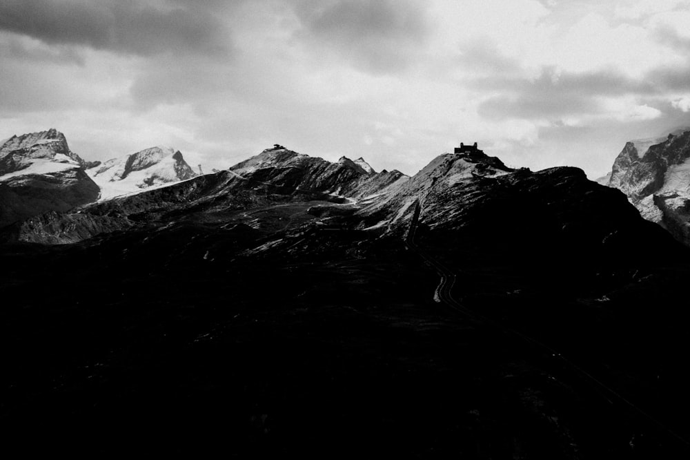 a black and white photo of a mountain range