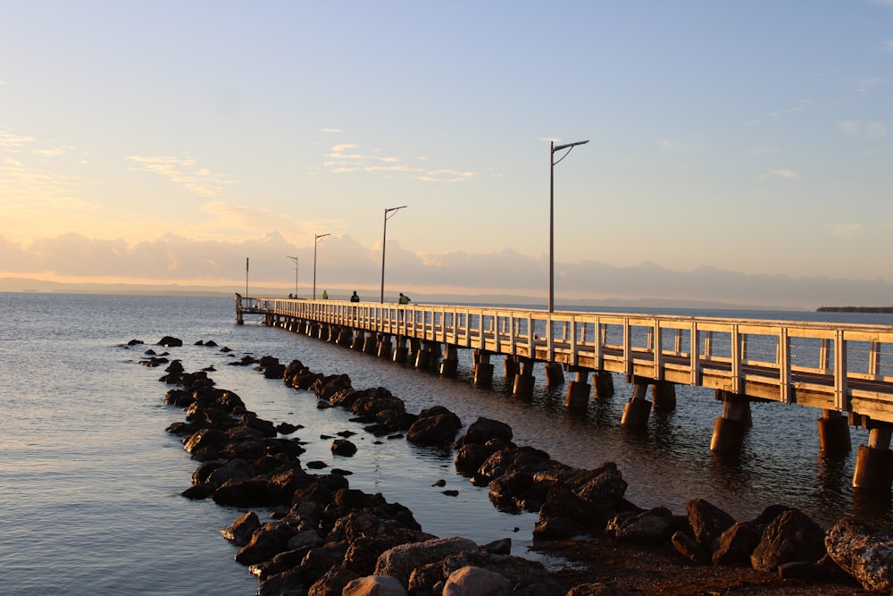 a long wooden bridge over a body of water