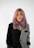 a woman with pink hair is posing for a picture