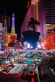 a city street filled with lots of traffic at night