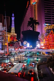 a city street filled with lots of traffic at night