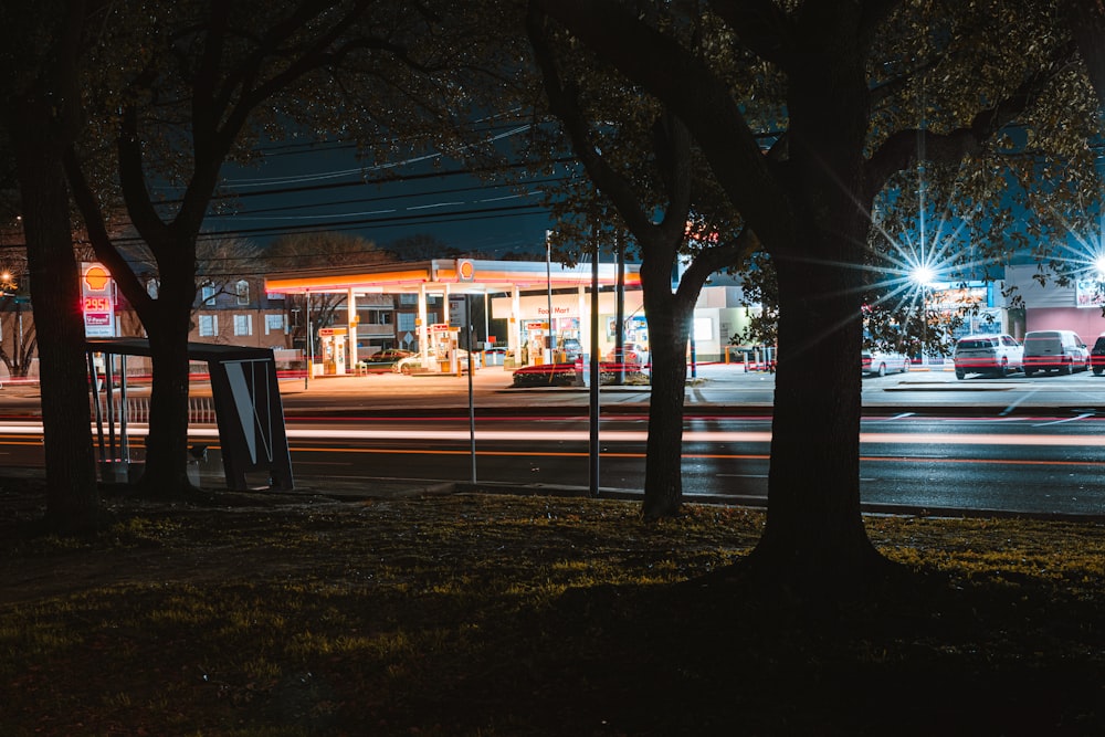 a gas station is lit up at night