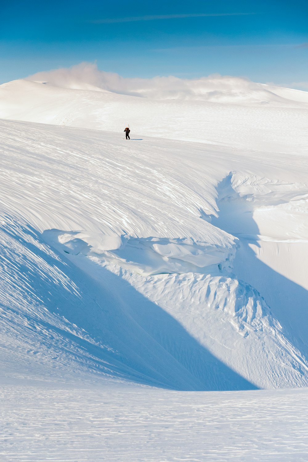 a person skiing down a snow covered mountain