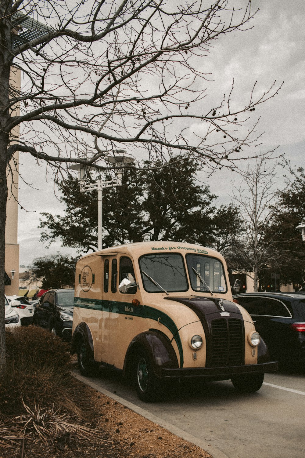 an old school bus parked in a parking lot