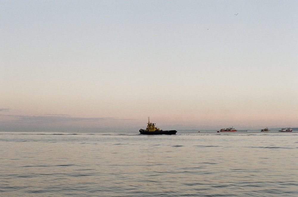 a small boat in the middle of a body of water