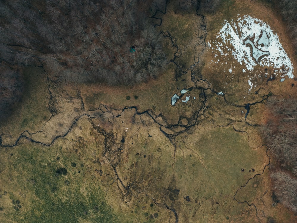 an aerial view of a snow covered field