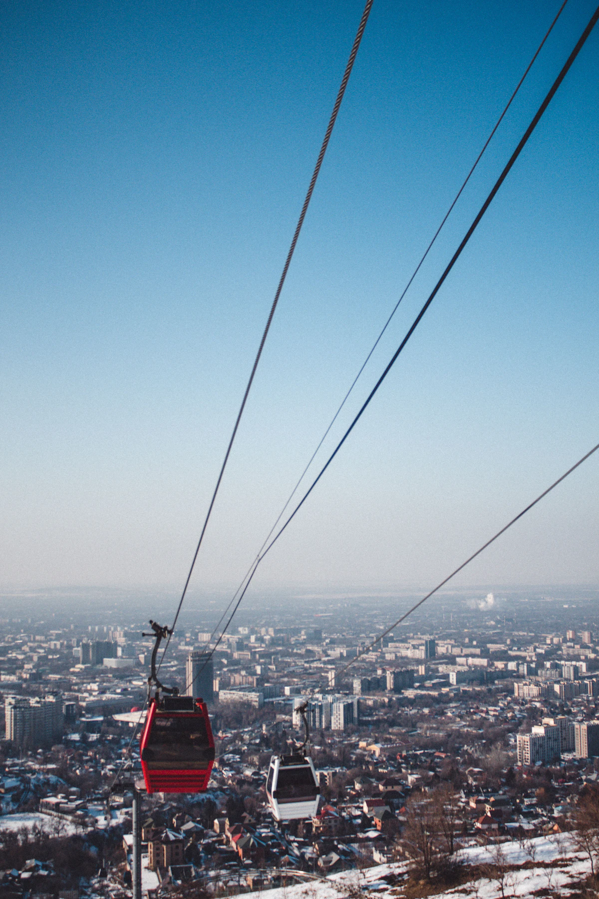 Cable car climbing toward a viewpoint above Almaty, Kazakhstan