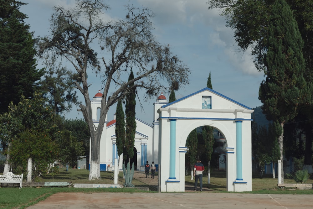 a white and blue building with a blue and white arch