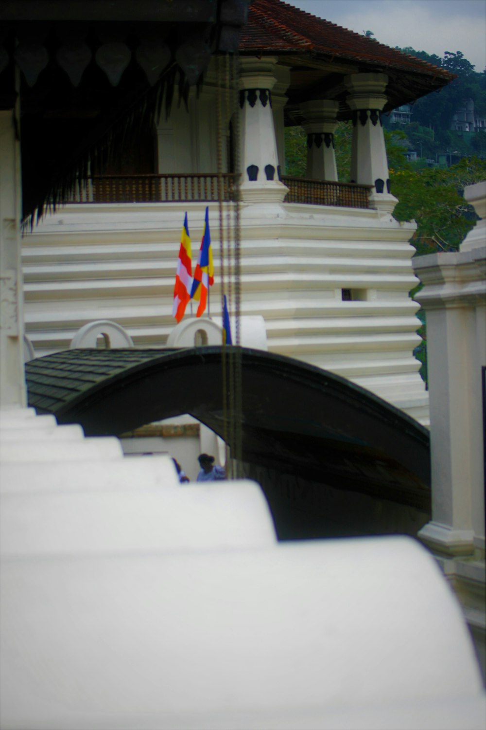 a white building with a black boat in front of it