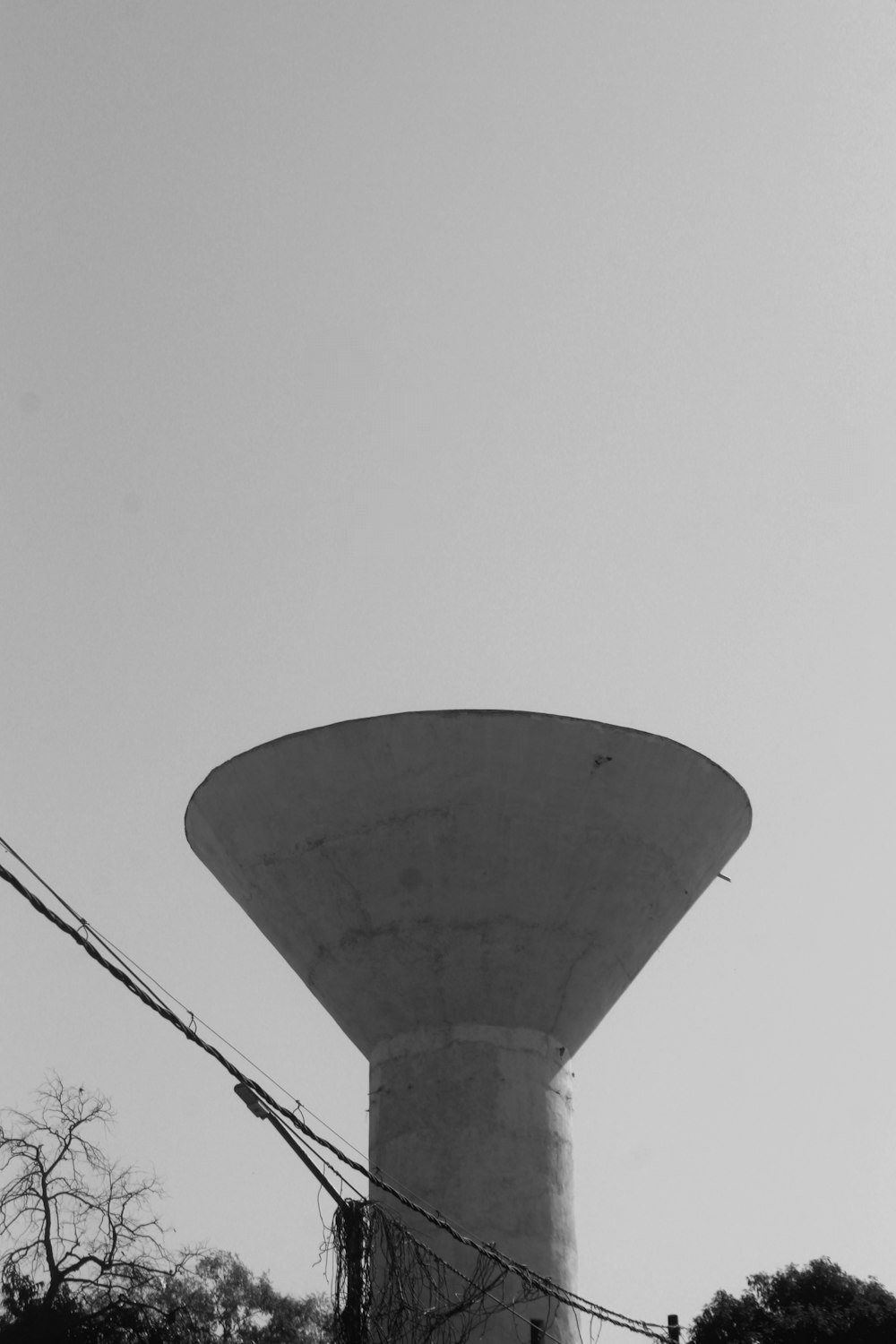 a black and white photo of a water tower