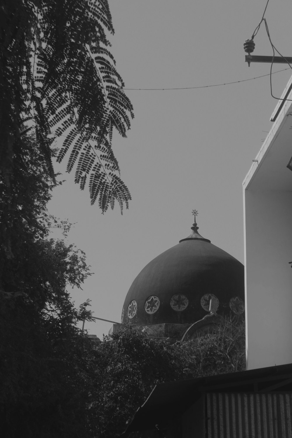 a black and white photo of a building with a dome