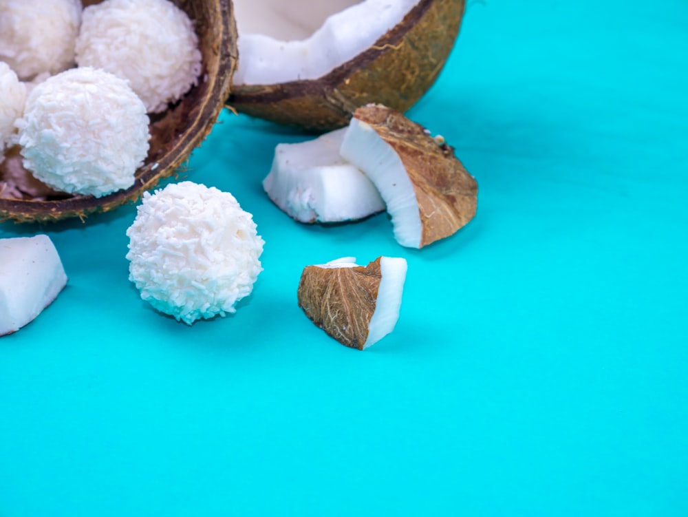 a couple of coconuts sitting on top of a blue table