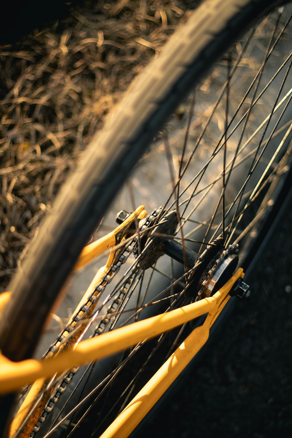 a close up of a yellow bicycle tire