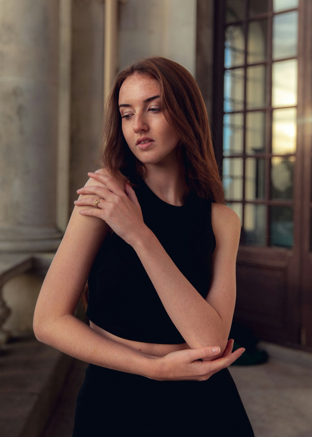 a woman in a black dress posing for a picture