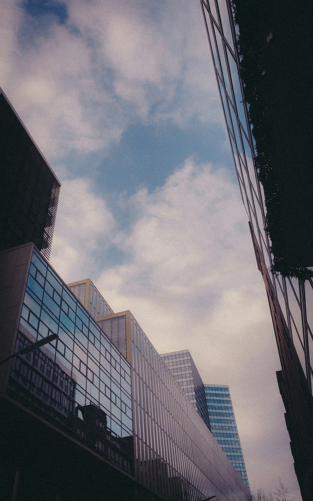 a tall building sitting next to a very tall building