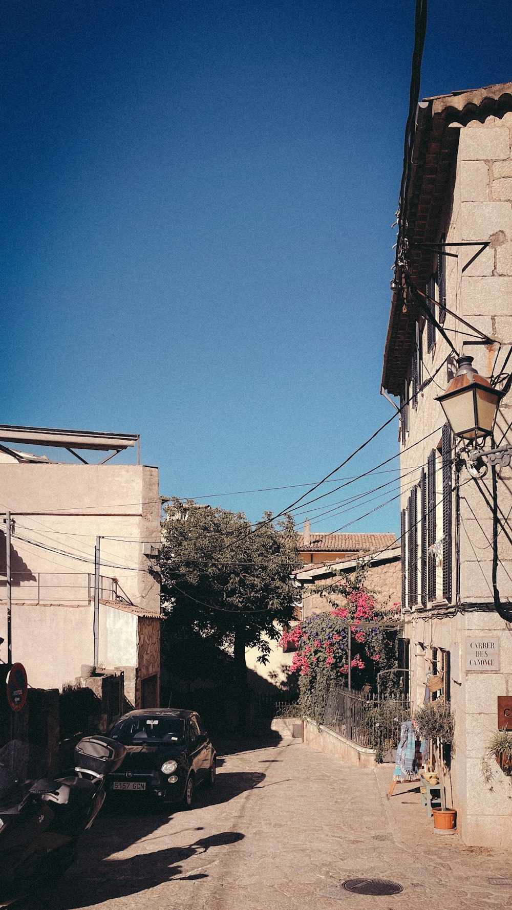 a street with cars parked on the side of it