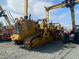 A fleet of heavy machinery lined up ready for deployment on an infrastructure project.