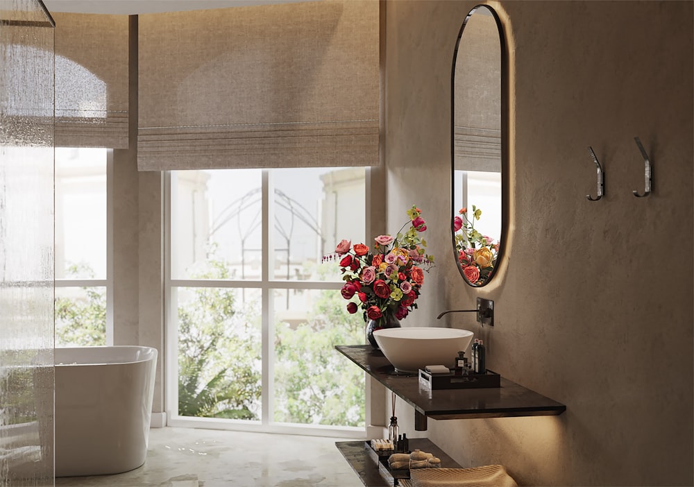 a bath room with a sink a mirror and a bath tub