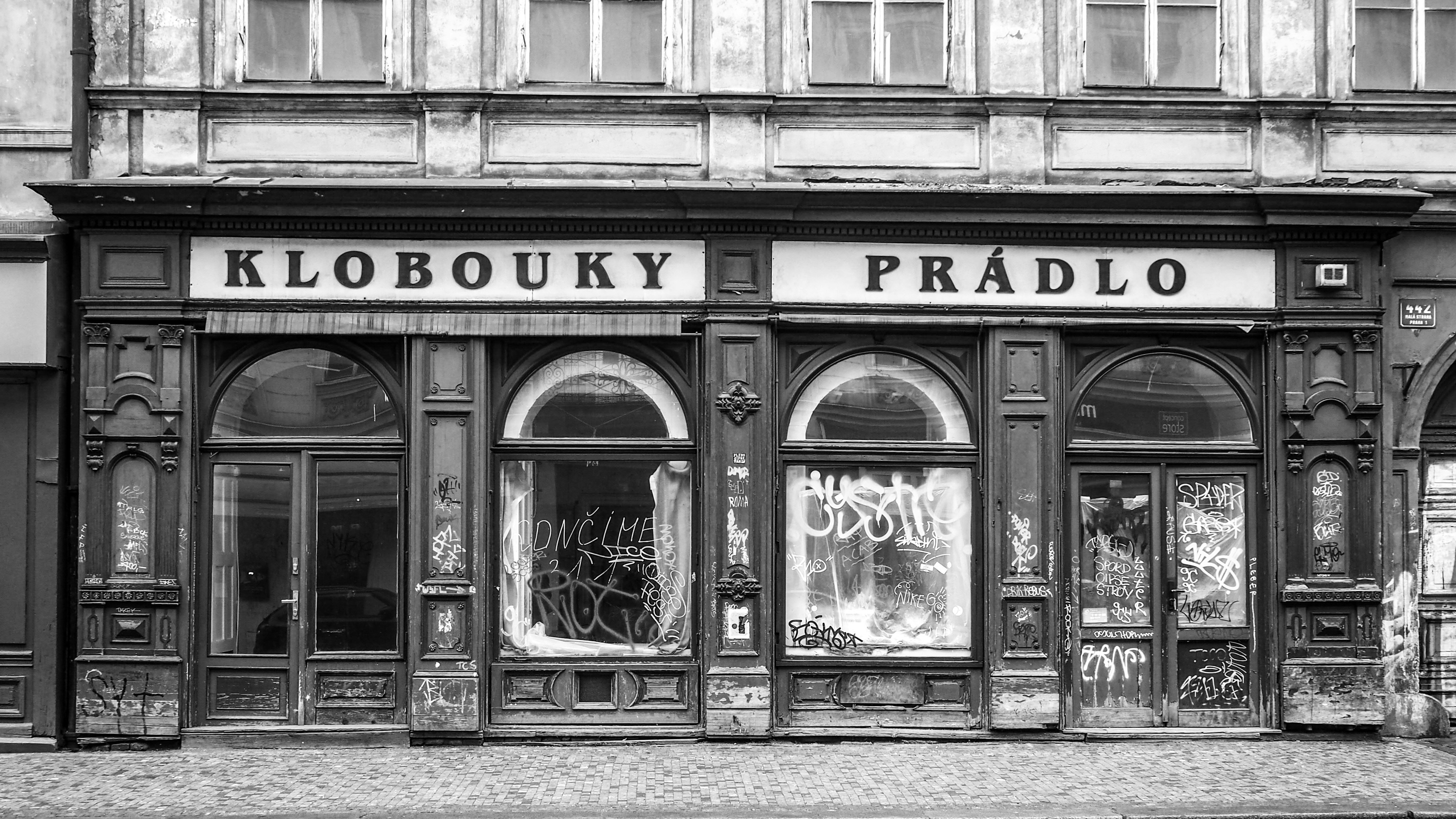a black and white photo of a store front