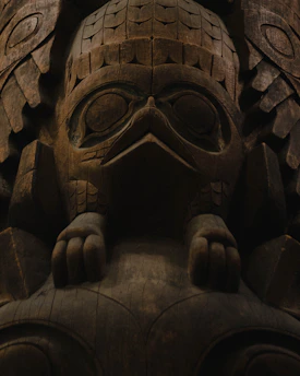 Rustic wood carving wall art showing intricate animal designs with natural textures.