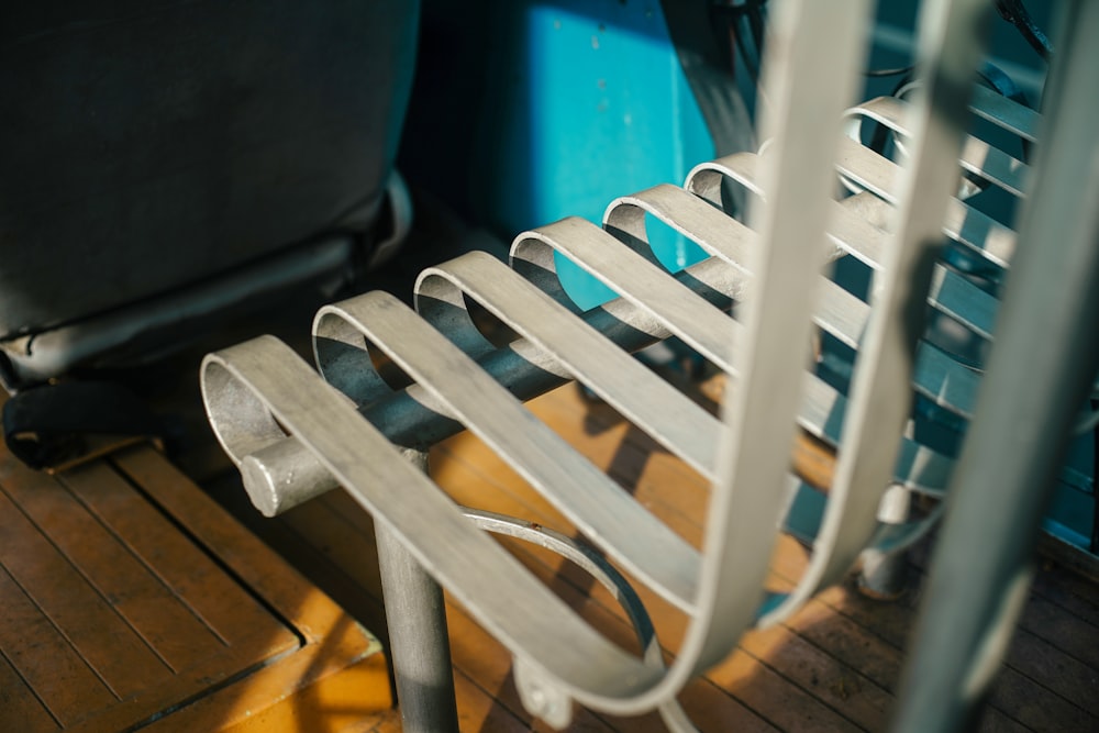 a close up of a metal rack on a wooden floor