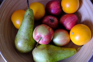 A collection of fresh fruits arranged on a kitchen counter.