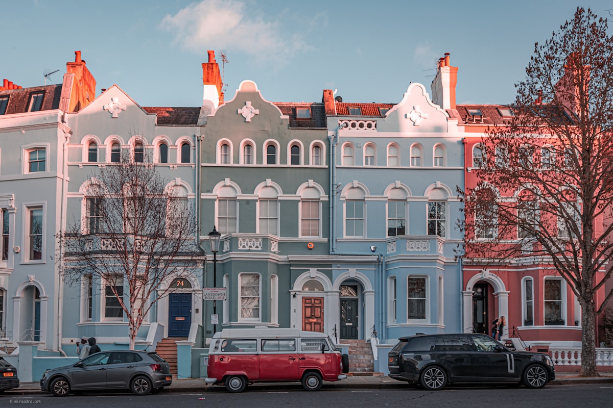 Row of London Victorian terraced houses with dormer and mansard roof extensions along the roofline