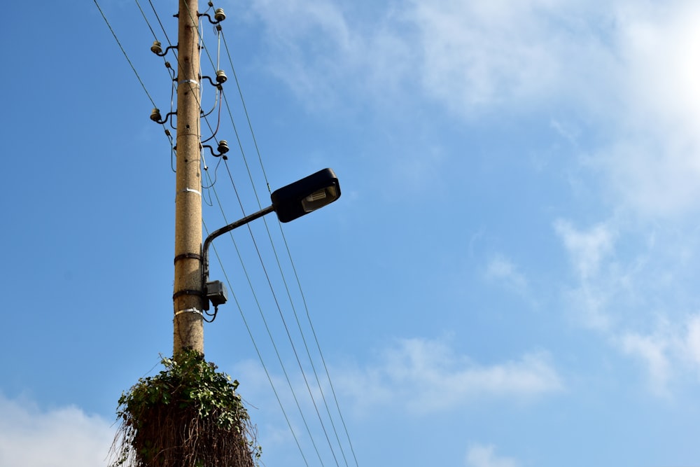 a street light on a pole with a sky background