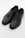 A pair of black leather dress shoes with intricate brogue detailing on the toe and sides, featuring laces and a polished finish.