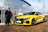 Happy man receiving keys to his imported European car outside the autonexis dealership.