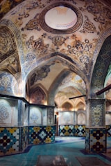 Close-up of intricate Moroccan tile work in warm gold hues inside a renovated property.