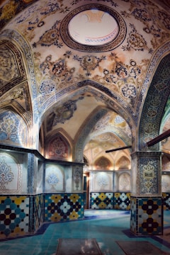 Close-up of intricate Moroccan tile work in warm gold hues inside a renovated property.