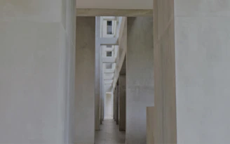 Clean hospital corridor with natural light and minimalist design.