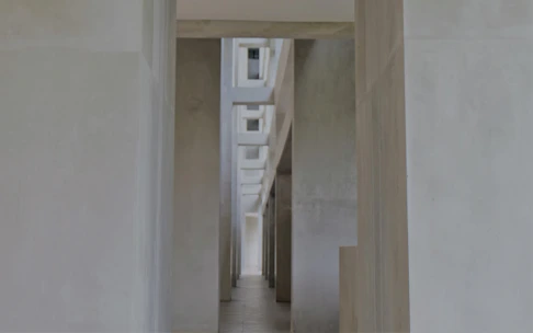 Clean hospital corridor with natural light and minimalist design.