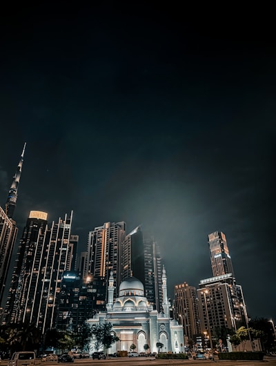 A sleek cinematic shot of a modern Islamabad skyline at dusk, highlighting architectural details with moody lighting.