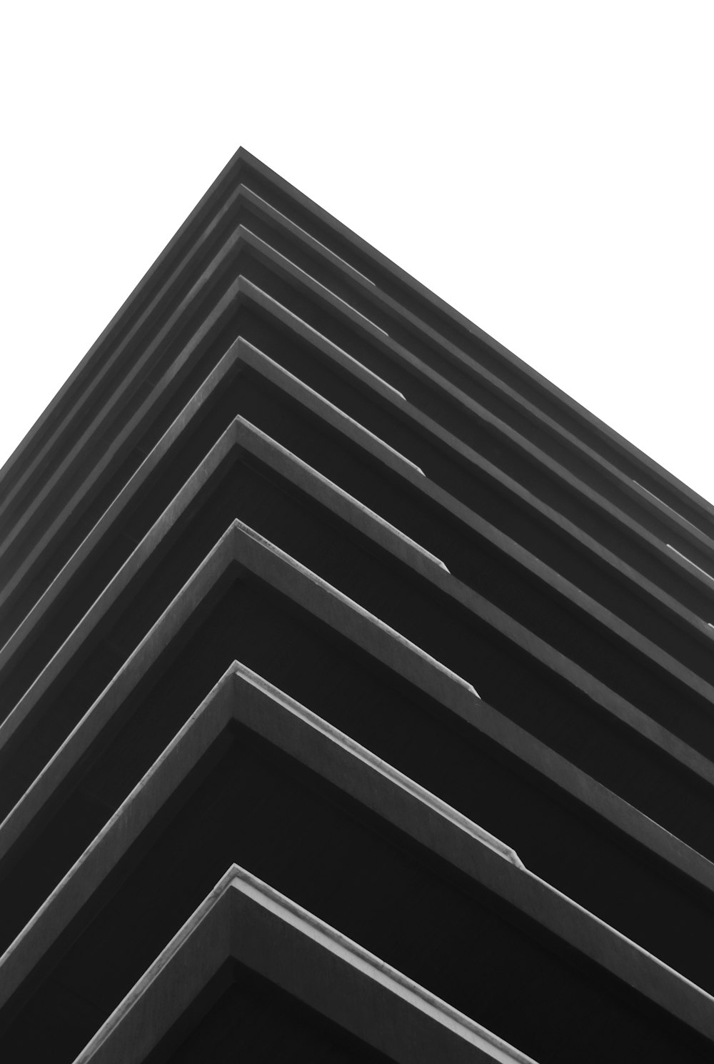 a black and white photo of a tall building