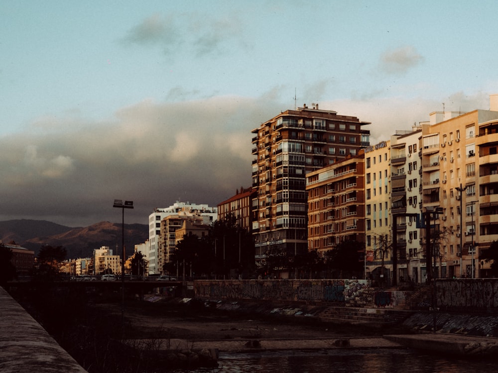 a river runs through a city with tall buildings