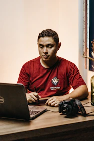 A person using a laptop at home to complete an online notarization.