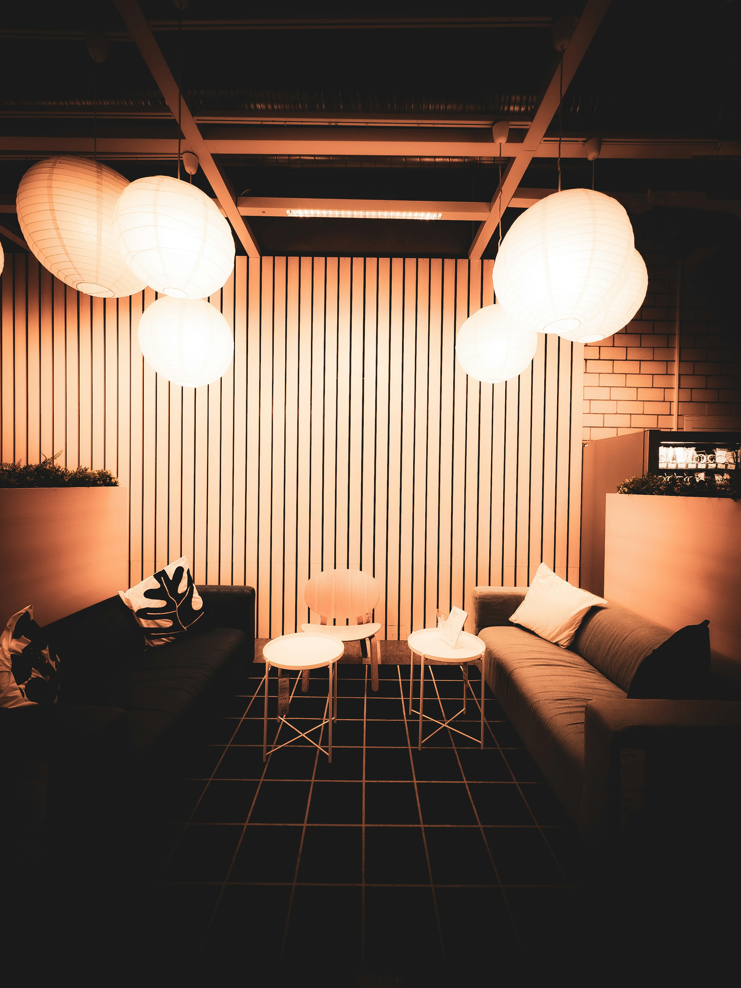 a living room with a couch a table and lamps