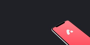 A smartphone with a red screen displaying a white abstract logo. The phone is positioned towards the lower right corner against a dark background, highlighting its sleek design.