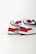 Two athletic shoes with bold red, white, and dark blue color blocking. The shoes feature a sleek, modern design with a flat sole and a recognizable logo in black on the heel. The upper part is made of a mix of textiles with some parts having perforations for breathability.